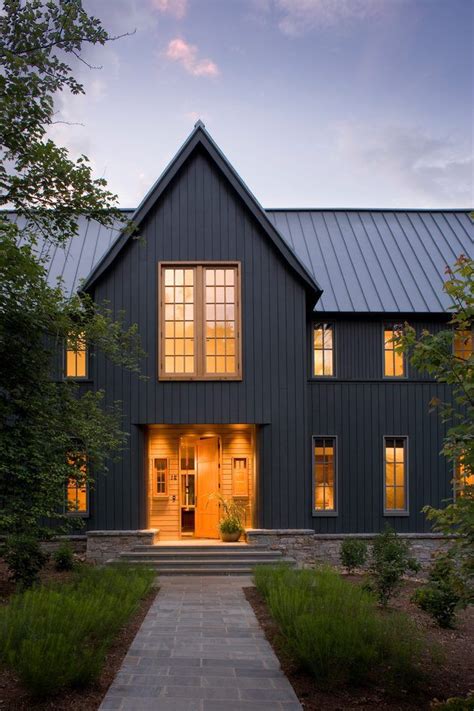 grey house with black metal roof|grey house with black awnings.